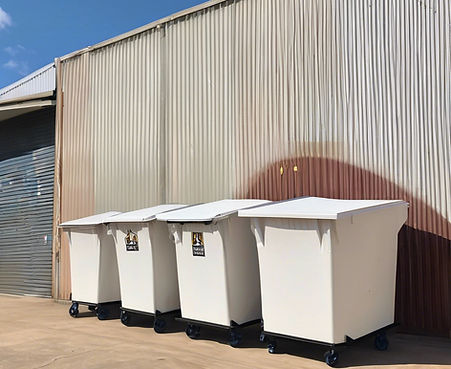 waste management recycling site with white bins_edited.jpg